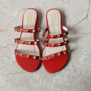 Red studded footwear